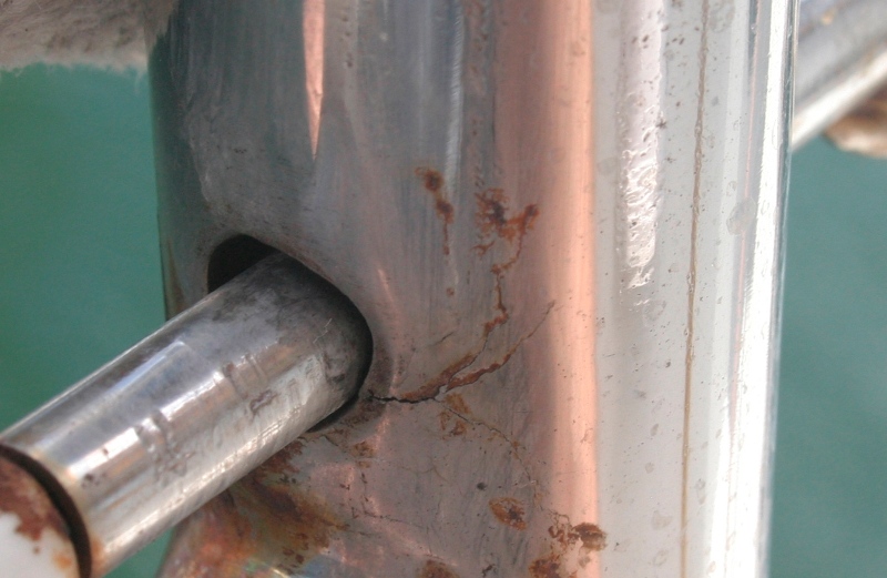 Crevice corrosion cracks around lifeline hole in stanchion gate